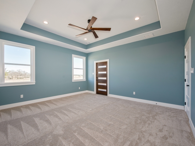 LaFollette Custom Homes bedroom with blue walls.