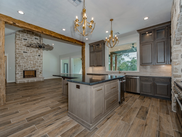 Kitchen of the Ball Circle Project by LaFollette Custom Homes with wood flooring and cabinets.