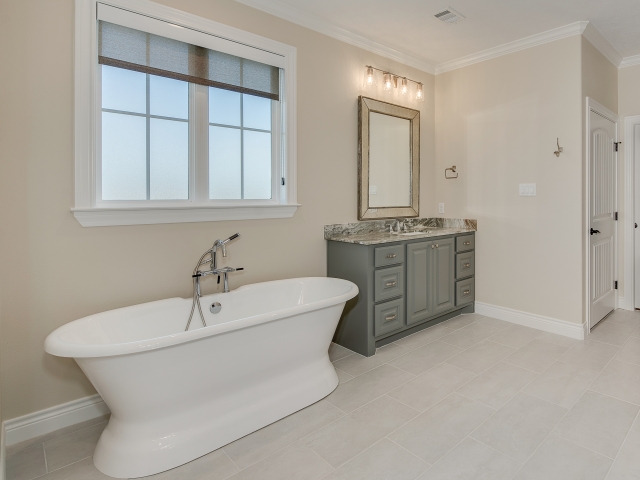 Master bath of the Taylor Project by LaFollette Custom Homes with large bathtub.