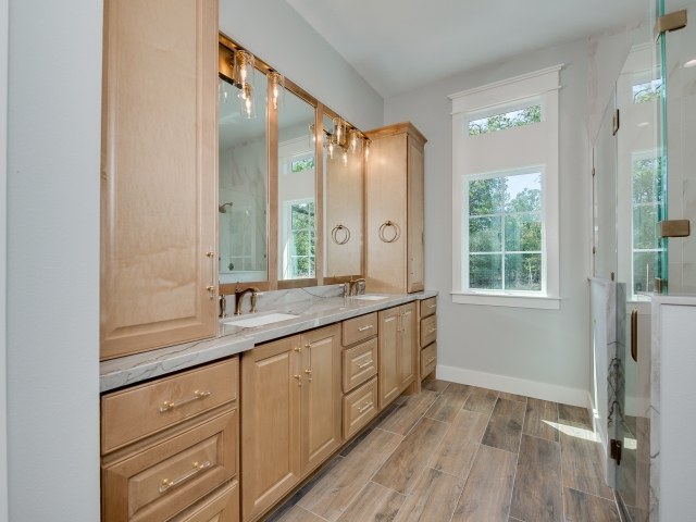 Master bath of the Ball Circle Project with wood cabinets.