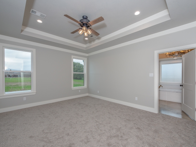 LaFollette Custom Homes bedroom with high ceilings.