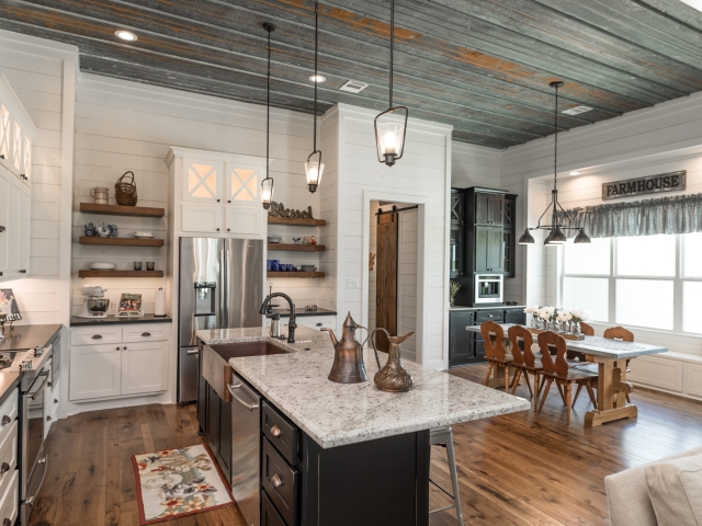 Kitchen of the Chisam Project by LaFollette Custom Homes with wood flooring.
