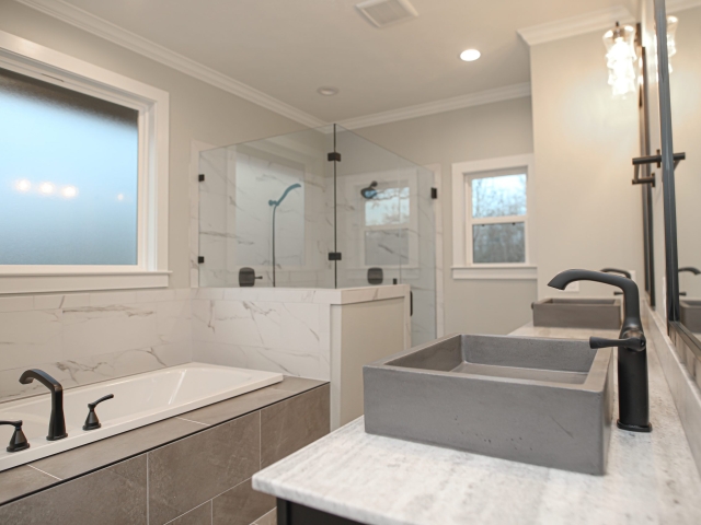 Master bath of the Atnip Project by LaFollette Custom Homes with marble details.