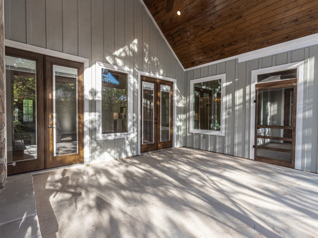Stunning image of many French doors on a custom built home.