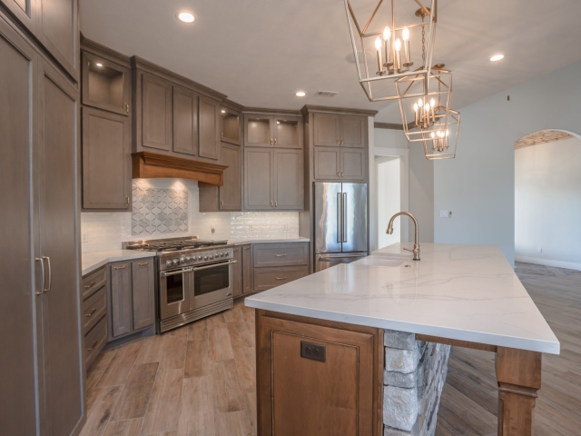 Kitchen of the Millican Project by LaFollette Custom Homes with white marble countertops.