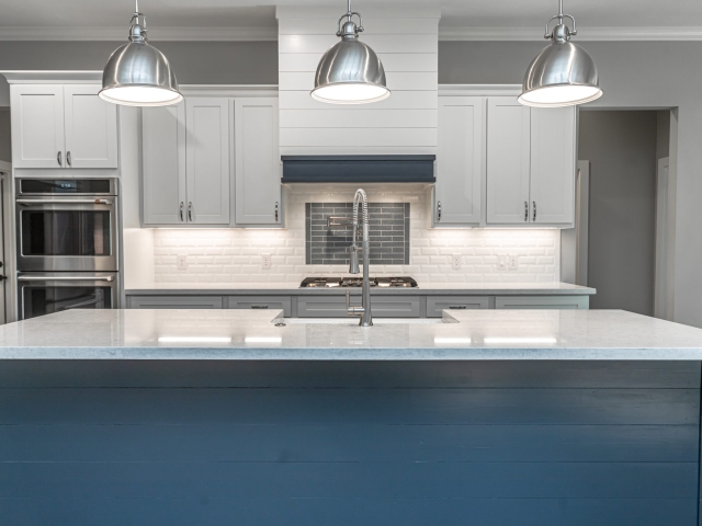 Kitchen of the Bishop Project by LaFollette Custom Homes featuring stunning blue cabinets.