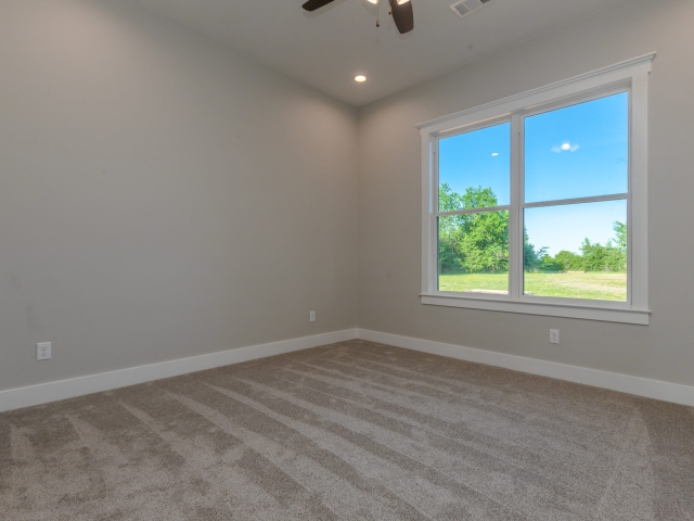 Bedroom with large windows.