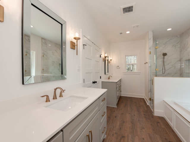 Master bath of the Bodner Project by LaFollette Custom Homes with white countertops.
