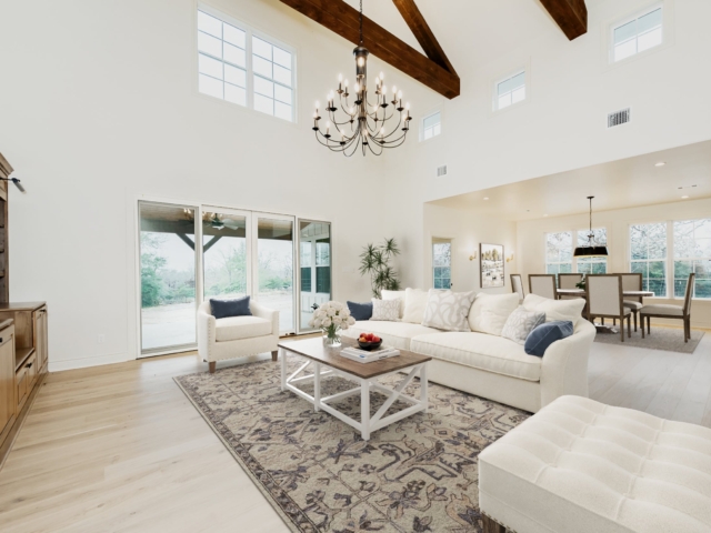Living room of the Washburn Project with high ceilings and white details.