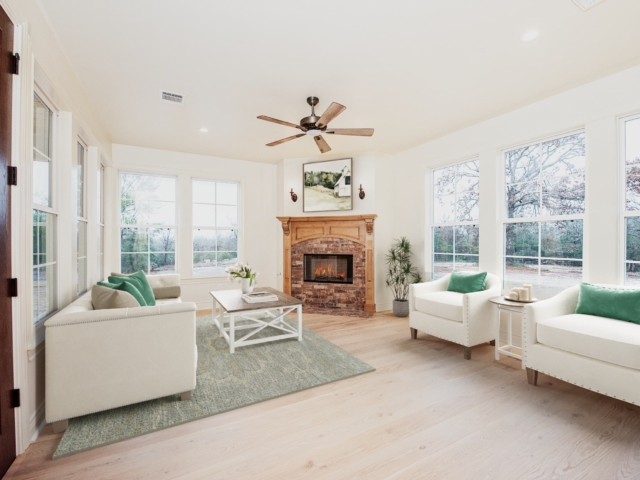 The sunroom of the Washburn Project by LaFollette Custom Homes with white details.