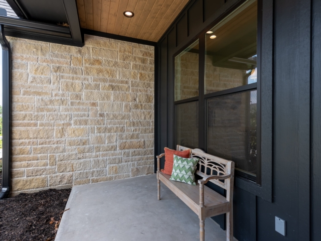 The Lakecrest custom home porch with black detail patio.