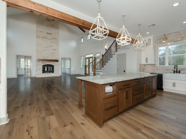 Hovey Project kitchen by LaFollette Custom Homes featuring wood cabinets and flooring.