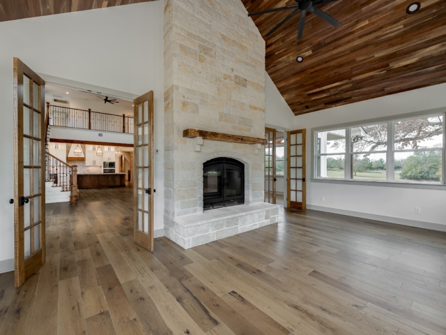Sunroom of the Hovey Project by LaFollette Custom Homes with stone and wood details.
