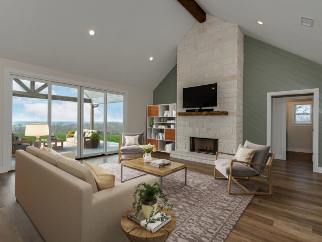 Living room of the Garrett Project by LaFollette Custom Homes featuring large glass sliding doors.